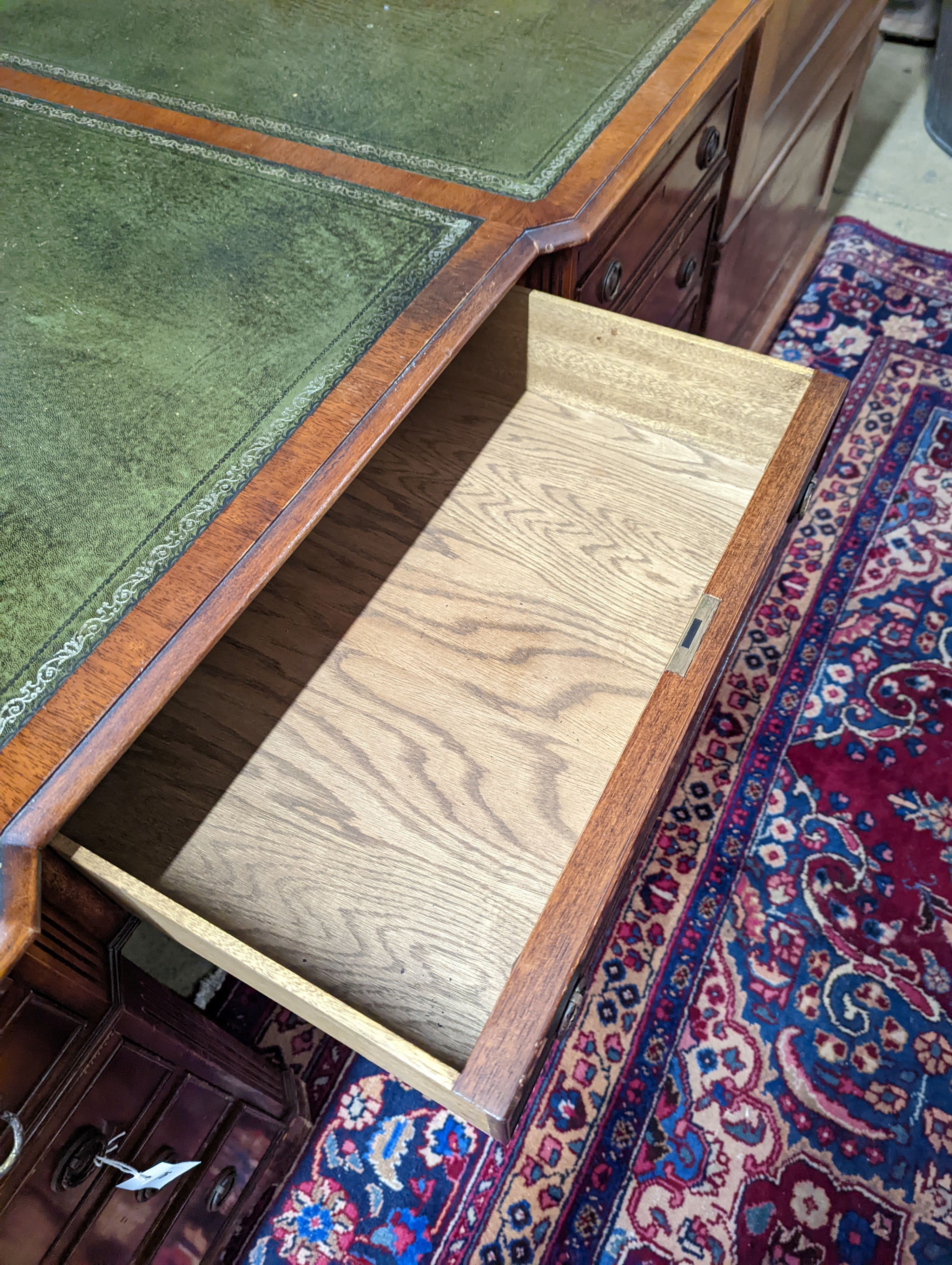 A reproduction George III style mahogany pedestal desk, length 150cm, depth 90cm, height 76cm